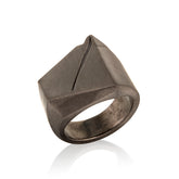 Bronze ring in 14k Gold with geometric design on a white background