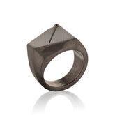 Black geometric ring in 14k Gold ring on a white background