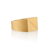 Gold ring 14k with a square face and an etched scar on a white background