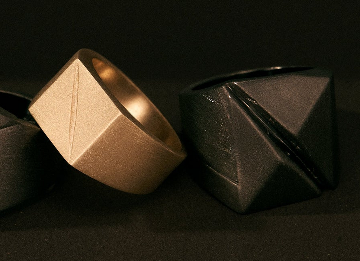 MZNR SCAR 01 solid gold men's rings showing brutalist geometric design and signature diagonal mark